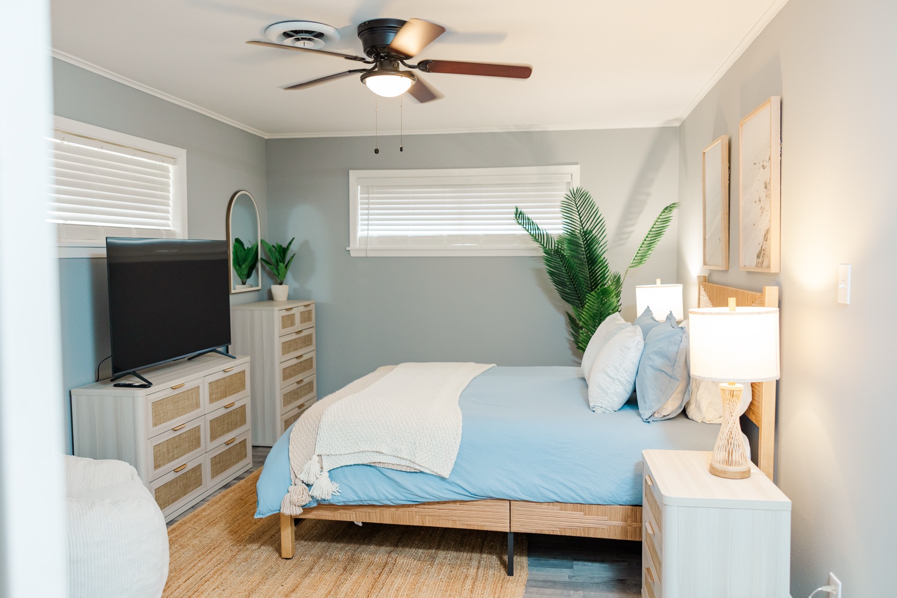 Blue bedroom with TV